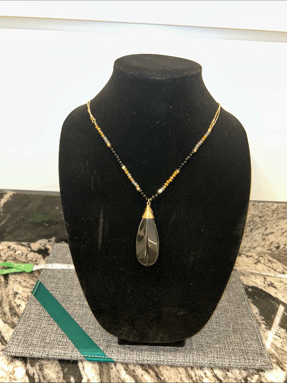 Natasha Couture Black Teardrop Pendant Necklace with Gold Accents